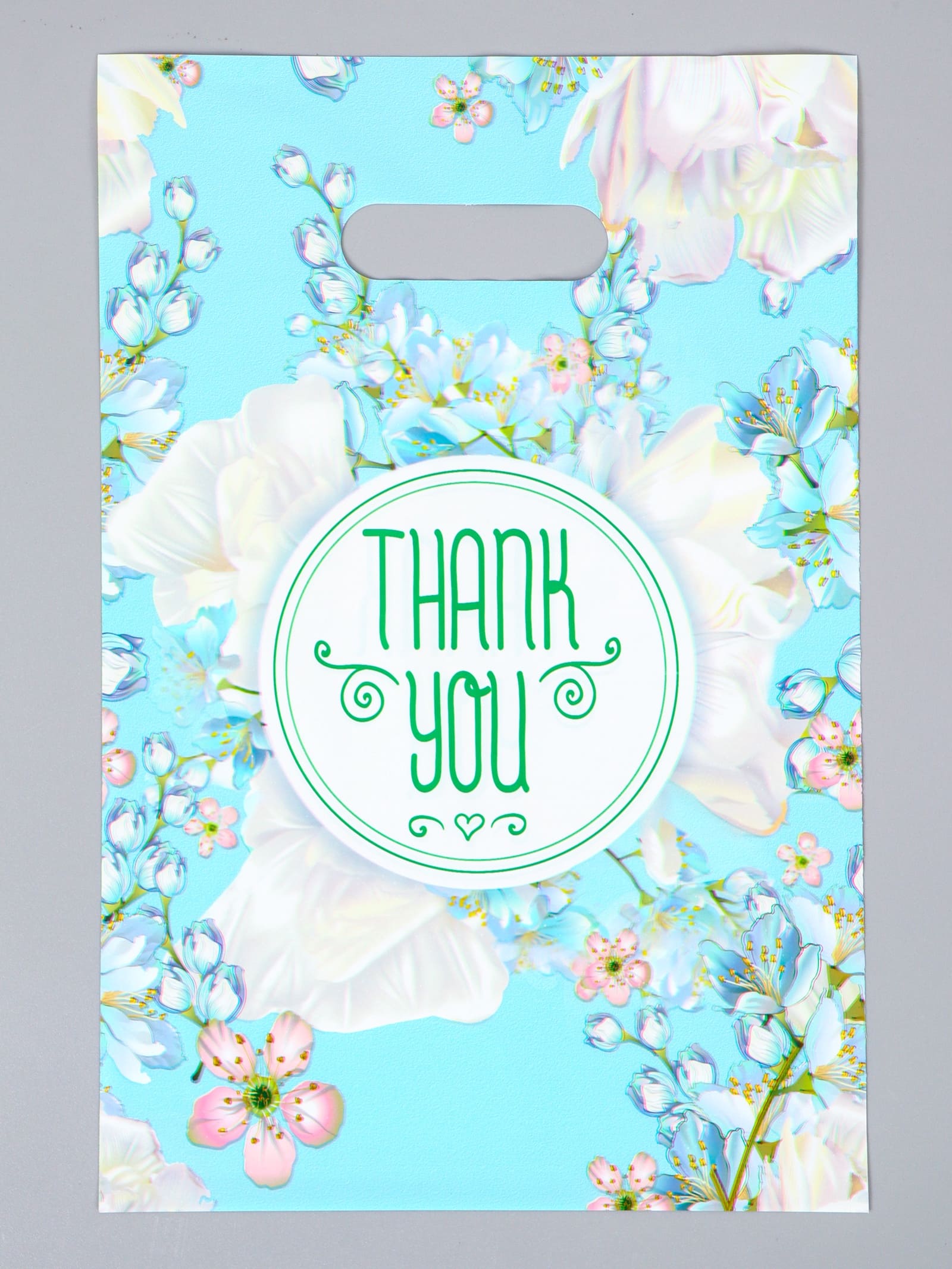 Пакет универсальный 20х30см "цветы" в голубом проруб.ручка 60мкм
